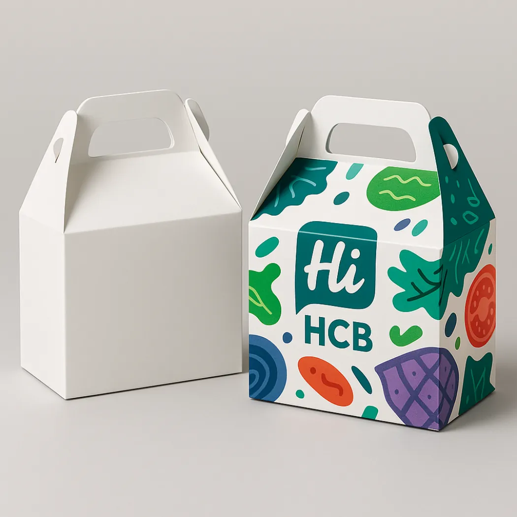 A white gable box alongside a custom printed version decorated with colourful vegetable-themed illustrations- class=
